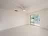 dining area leading to sliding patio doors