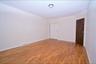 3rd Floor bedroom with light wood-type flooring and baseboards