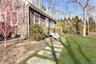 View of side of property featuring a yard