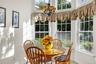 Sunroom featuring a chandelier