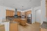The spacious kitchen offers abundant cabinetry, generous workspace, and exceptional storage.