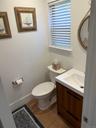 Bathroom with vanity and dark wood-style floors