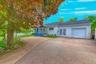 Front of house with the driveway and garage