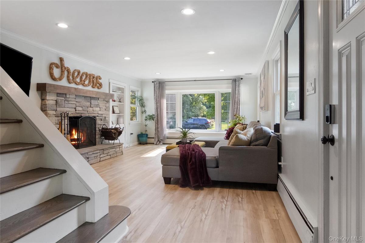 Welcome Home. Curl up in front of the wood-burning cultured stone fireplace. The bay window offers views of the front flower garden where you can watc