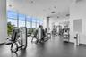 Fitness center with modern equipment and bay views