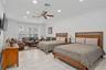 Downstairs Primary Bedroom with large sitting area. Has a door leading outside so could be used as an in law suite as well.