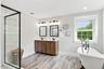 Dbl vanity, soaking clawfoot tub, glass shower, large linen closet and updated tile