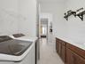 Laundry Room accessible from Primary Bathroom