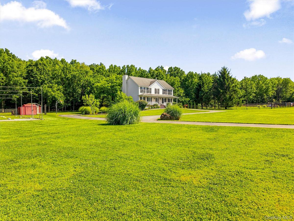 View of house looking across the expansive yard.