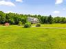 View of house looking across the expansive yard.