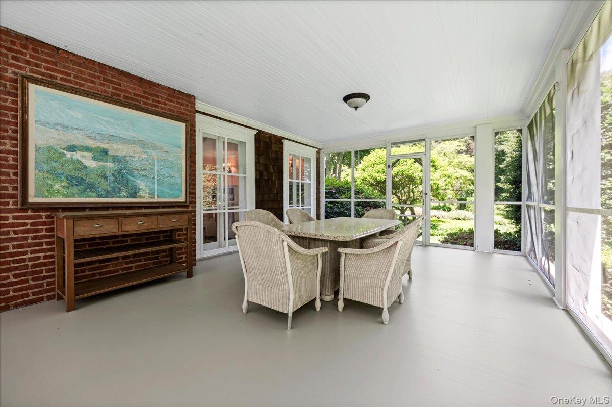 Accessed by way of the living room's French doors; fully screened porch
