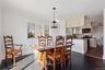 Dining area featuring ornamental molding, dark hardwood / wood-style floors, and ceiling fan