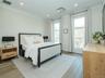 The inviting primary bedroom fits a king-size bed, offers two closets, ample natural light, and includes an en-suite bath.