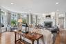 Spacious family room featuring 6" wide planked flooring and a woodburning fireplace