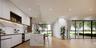 Kitchen featuring modern cabinets, white cabinetry, a sink, recessed lighting, and open shelves