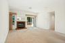 Living room with fireplace*,recessed lights & view to hallway/laundry/ bedroom area