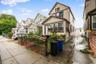 View of front of property with a gate and a residential view