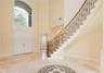 custom travertine inlay in the foyer