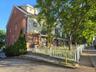 Front of the complex featuring freshly restored and painted exterior and trim!