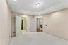 Carpeted room featuring a tray ceiling with recessed lighting and a central flush mount fixture