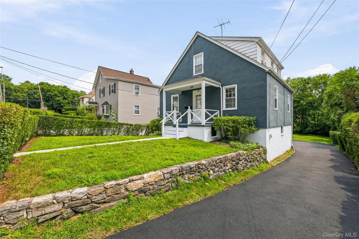 Front of home with large driveway