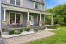 Classic rocking chair covered front porch, a home you will be proud to call your own