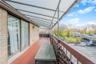 Balcony featuring a sunroom
