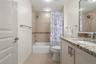 Conveniently positioned off the hallway, the guest bath offers both accessibility and a clean, timeless design.