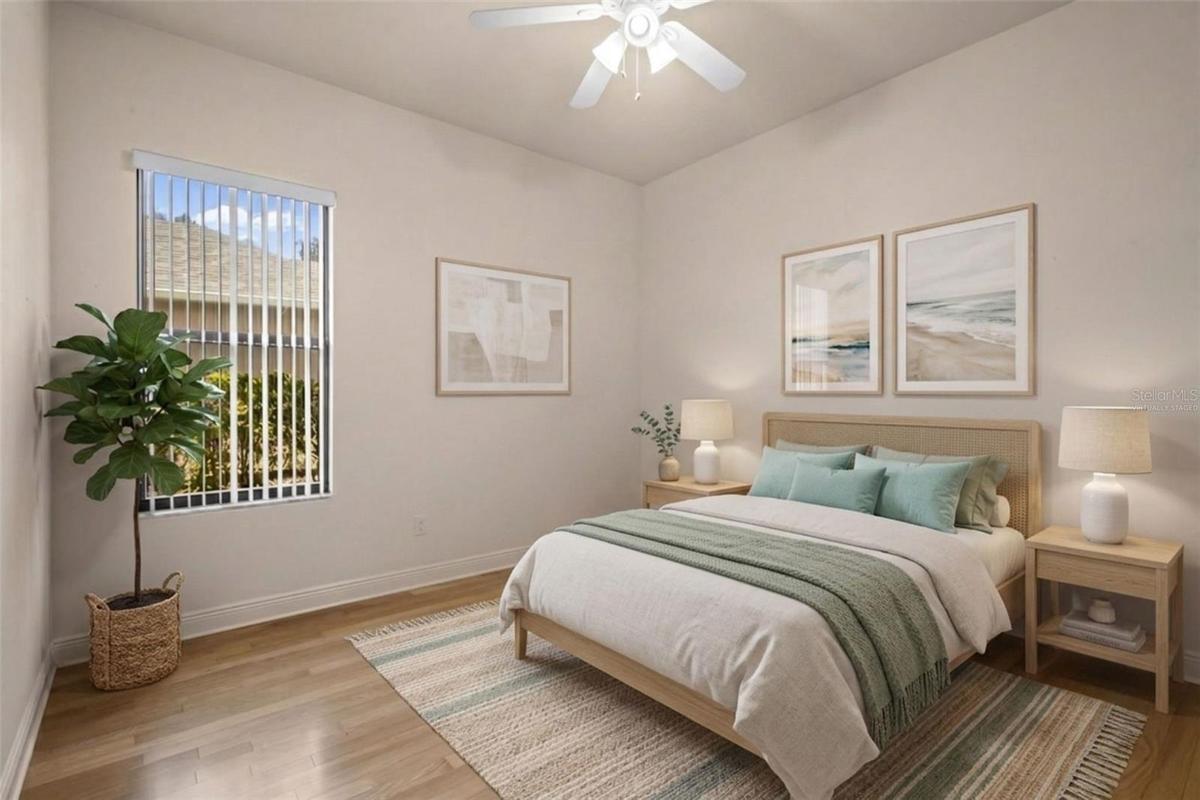 A comfortable secondary bedroom with flexible space for family members or overnight guests. - virtually staged