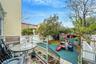 Wooden deck with a shed, a fenced backyard, and outdoor dining space