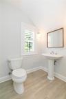 Powder Room is modern, stylish.