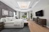 The owner’s suite serves as a luxurious private retreat, thoughtfully designed to capture peaceful views and provide seamless access to the outdoor li