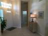 Front entrance shows off the split floor plan. Through the corridor is the two guests rooms & guest bath.....