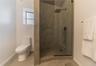 Full bath with a stall shower and toilet