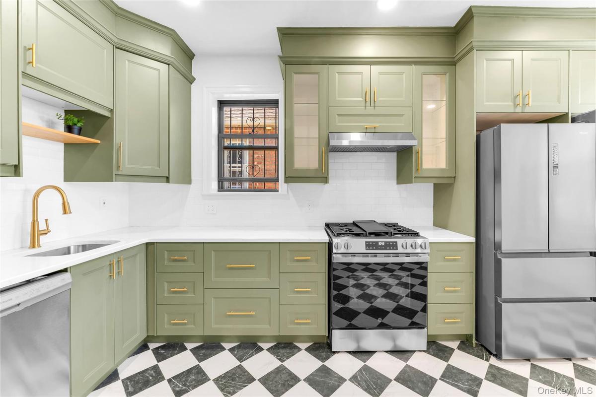 Upper level custom eat-in kitchen with stainless steel appliances