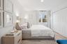 Bedroom featuring light wood finished floors, recessed lighting, and a closet