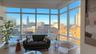 Sunroom featuring a city view and plenty of natural light