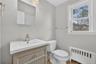 Unit #2-Move-in ready hall bathroom with updated details.