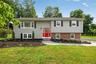 Welcome to 6 Linda Ln, an attractive raised ranch on a level, corner lot