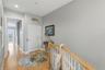 Stairway up to the third level (don't forget, you can also take the private elevator!) which includes the master, guest bedroom on opposite end and th