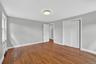 Unit #2-Spacious primary bedroom offering a calm, comfortable retreat with generous closet space.