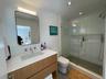 Bathroom featuring a shower stall, vanity, recessed lighting, toilet, and tile patterned floors