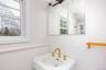 Bathroom featuring a sink and wainscoting