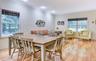 Legal accessory apartment: Open-concept living area featuring wood flooring, recessed lighting, and crown molding