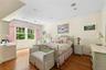 Bedroom featuring ornamental molding, dark wood-style floors, and recessed lighting