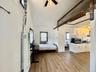 5 - Bedroom featuring beam ceiling, baseboards, and light wood-type flooring