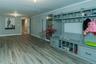 Mudroom with wood-type flooring and ornamental molding