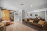 The barn doors unfold a home office space.