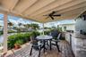 Covered shade space with pavers & a kitchen area