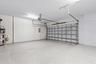 Oversized 2 car garage is meticulously maintained and features premium floor finish. Newer hot water heater and water conditioning system.